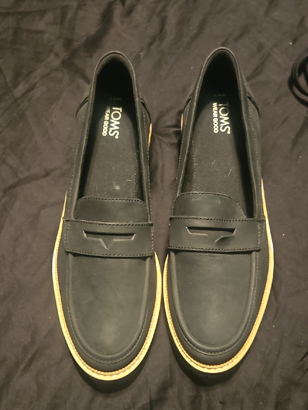 TOMS Black Women’s Slip-On Penny Loafers with Tan Trim